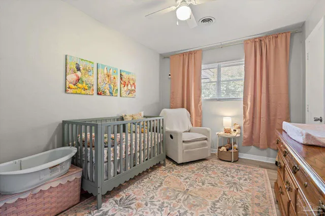 a bedroom with furniture and a window