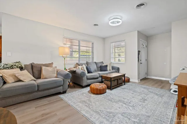 a living room with furniture and a window