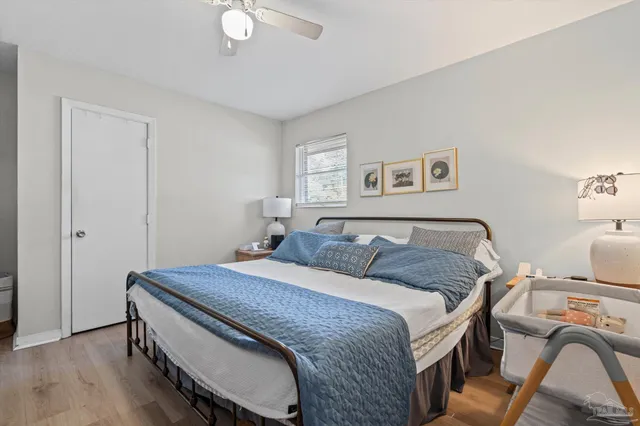 a bedroom with a bed and a table in it