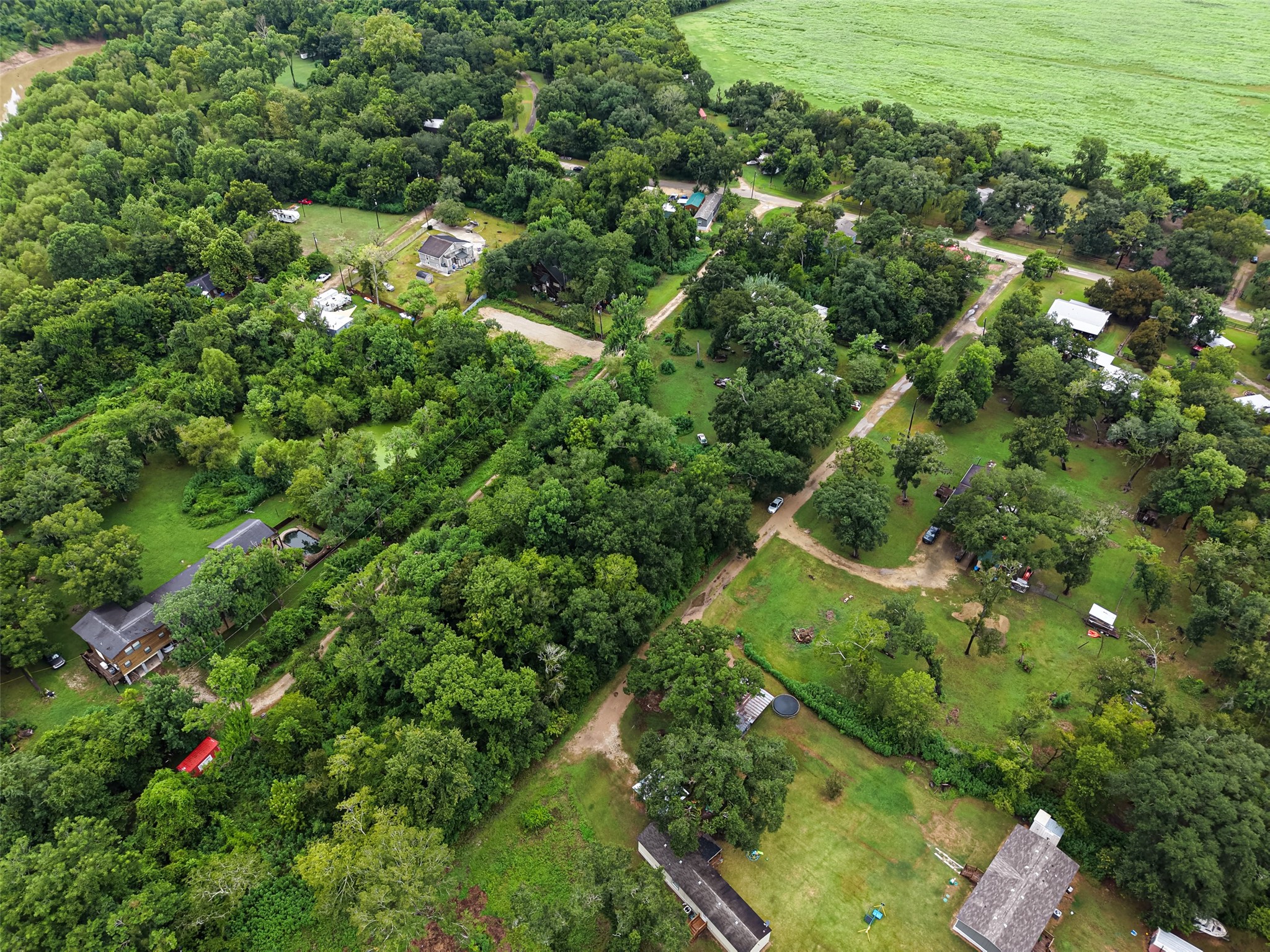 0 Pine Street Rosharon, TX 77583 - Photo 9 of 11 Elevated perspective highlighting the surrounding neighborhood, offering a great look at the property's convenient access and tranquil rural setting.