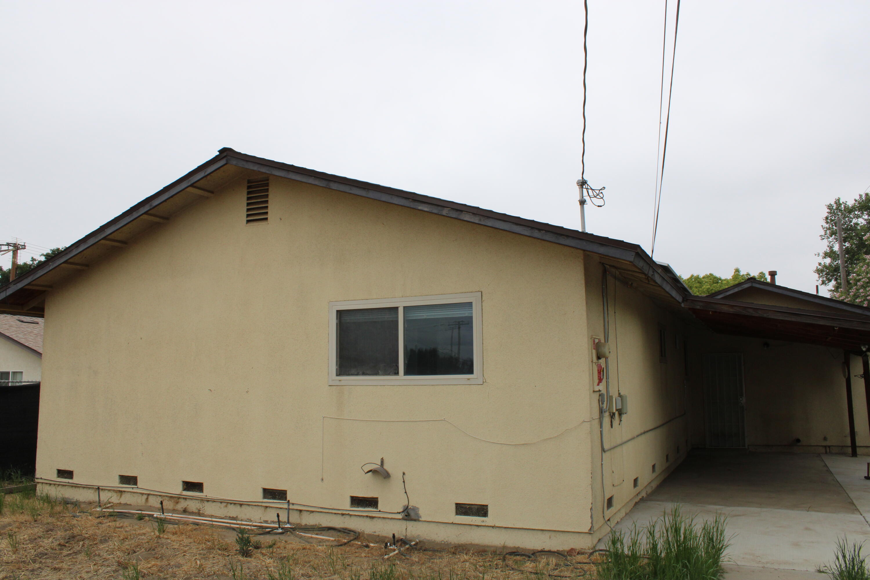 517 South R Street Tulare, CA 93274 - Photo 20 of 21 a front view of a house with trees