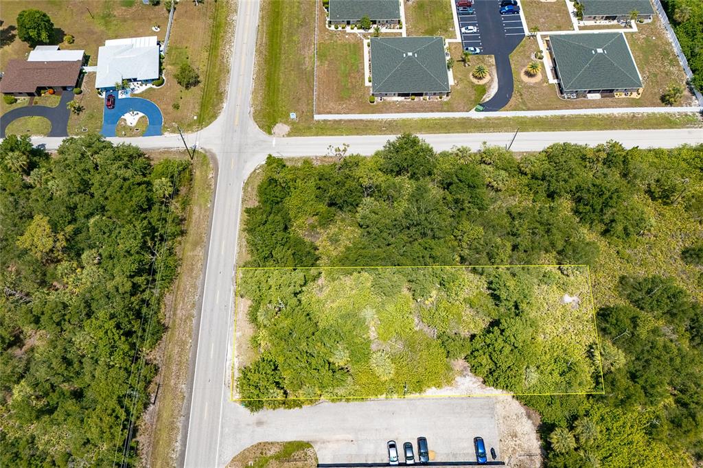 25018 Harbor View Road Punta Gorda, FL 33980 - Photo 2 of 12 an aerial view of residential house with pool and trees in the background