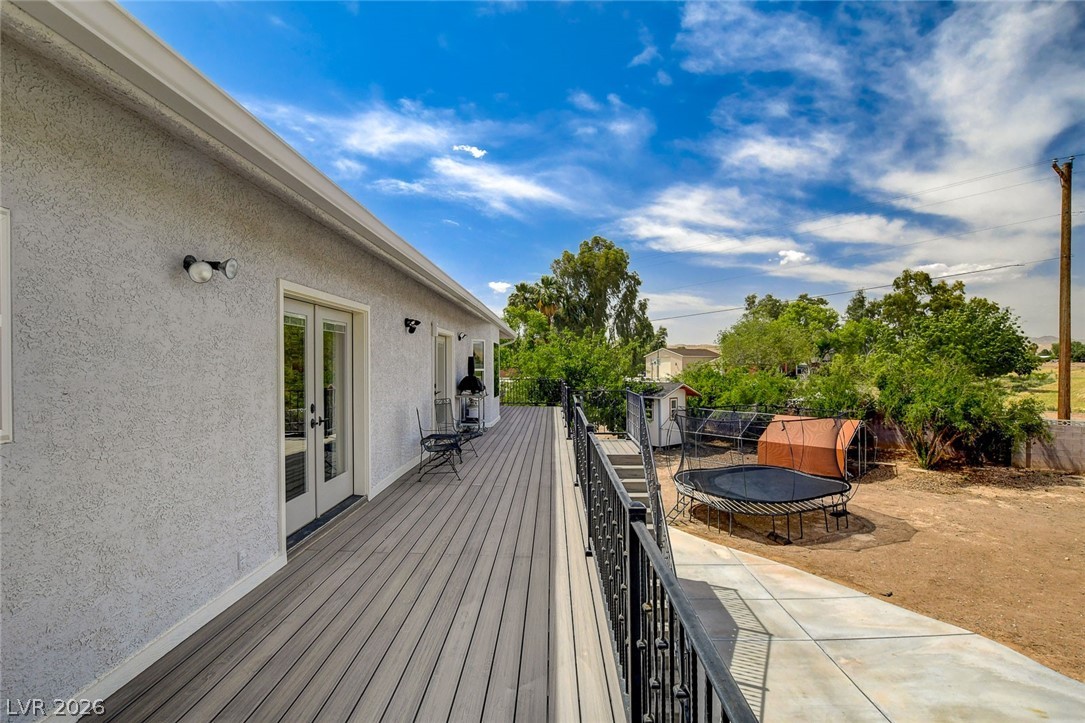 4362 Thistle Street Logandale, NV 89021 - Photo 74 of 99 A spacious deck extends from the home, offering an elevated vantage point over the natural landscape.