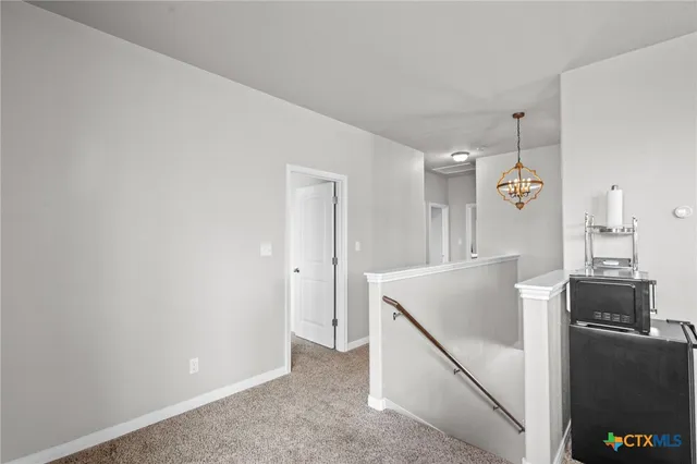a room with table and a stove