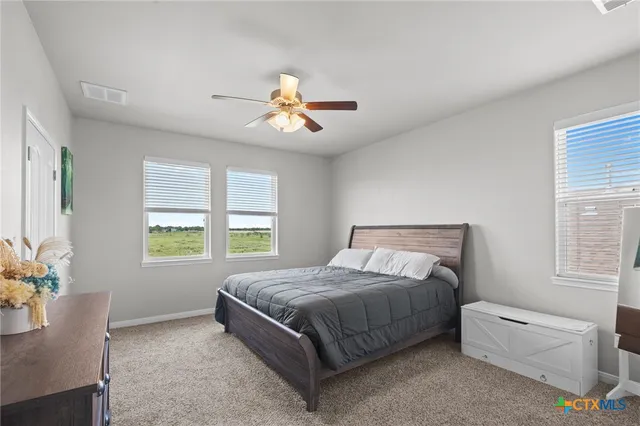 a bedroom with a bed and a couch