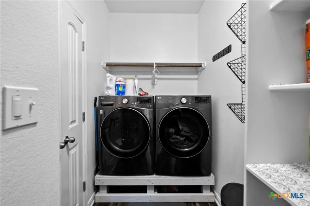 a utility room with dryer and washer