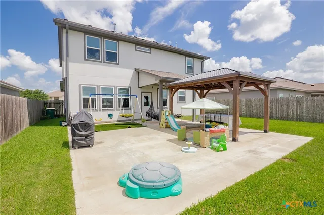 a house view with a backyard space
