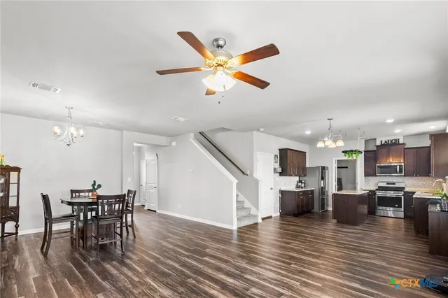 a view of kitchen with cabinets and wooden floor