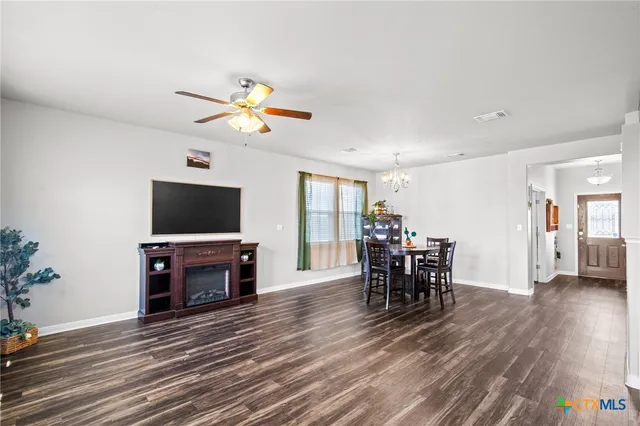 a view of a livingroom with furniture and a flat screen tv