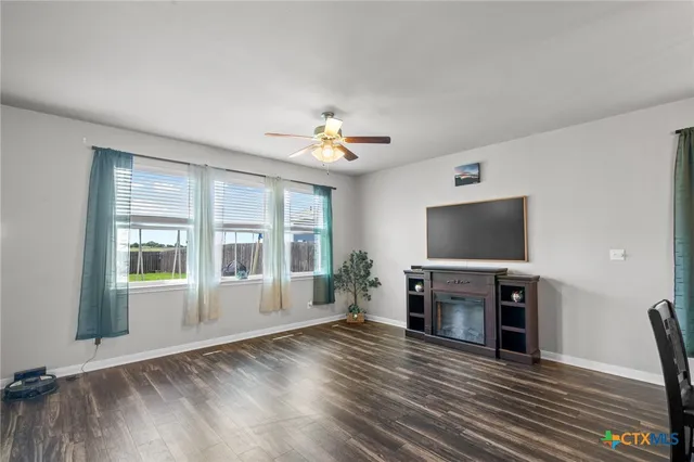 a view of livingroom with furniture flat screen tv and window