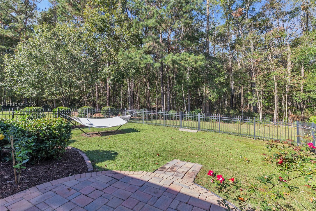 8 Abbotsbury Place Bluffton, SC 29910 - Photo 1 of 1 Deep wooded preserve views patio and fence