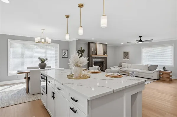 a view of kitchen with sink and living room