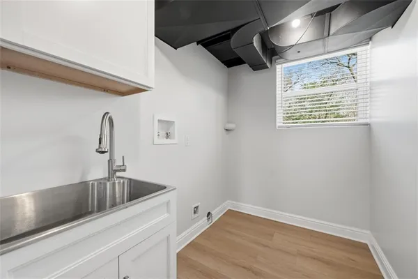 a bathroom with a sink and a window