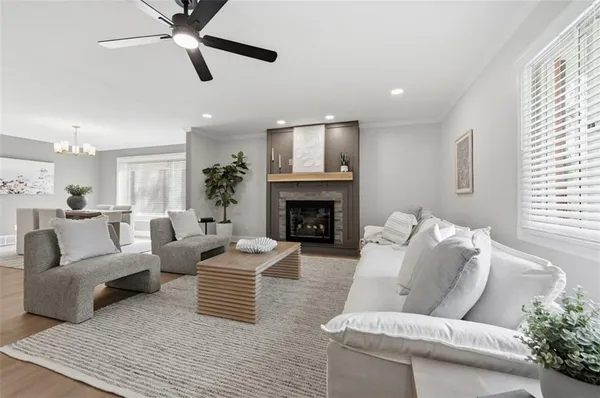 a living room with furniture and a fireplace