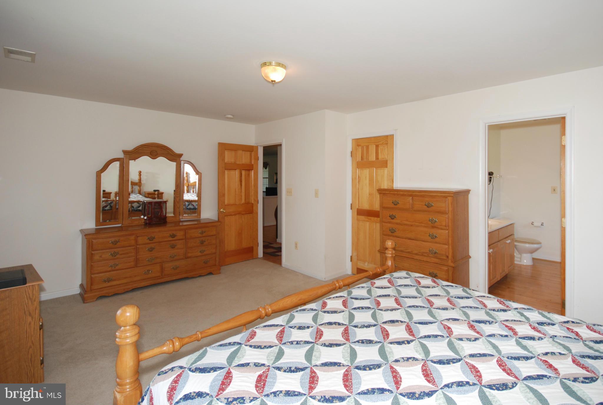 2118 Laurel Grove Road Winchester, VA 22602 - Photo 17 of 29 a bedroom with a bed and a dresser