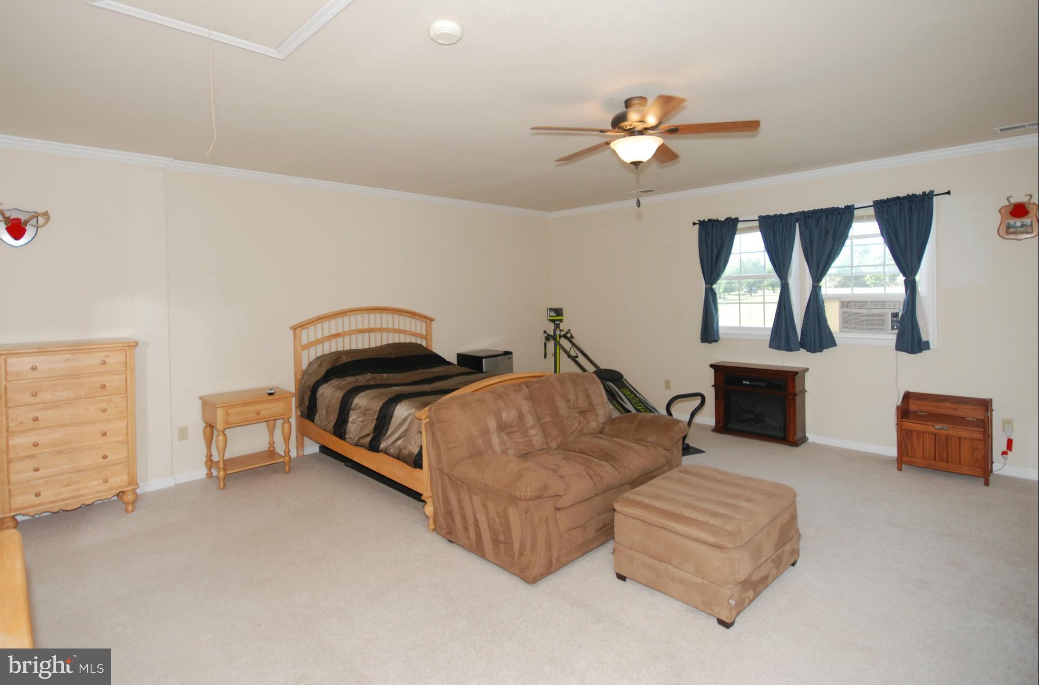 2118 Laurel Grove Road Winchester, VA 22602 - Photo 21 of 29 a bedroom with furniture and a chandelier