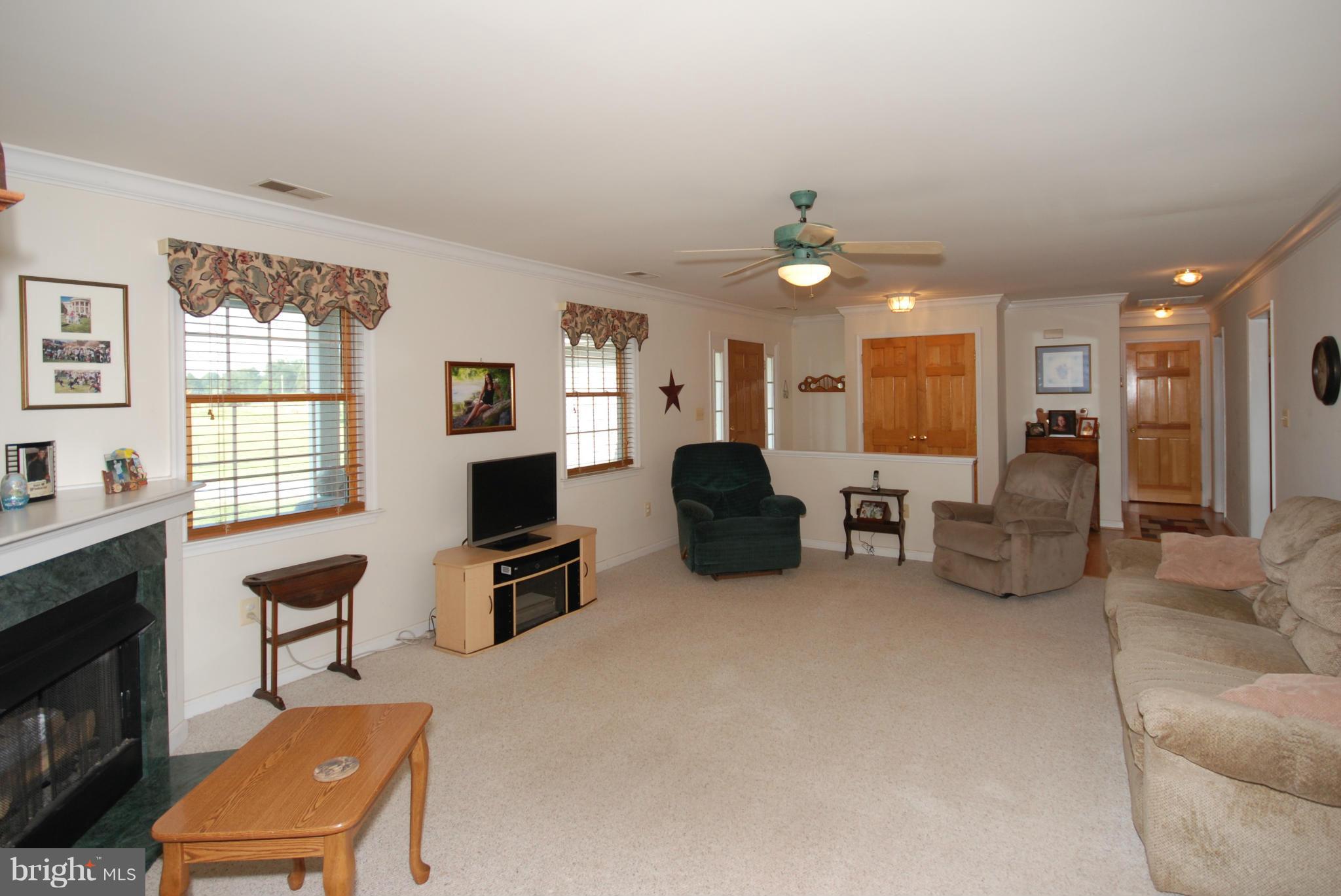 2118 Laurel Grove Road Winchester, VA 22602 - Photo 6 of 29 a living room with furniture a fireplace and a flat screen tv