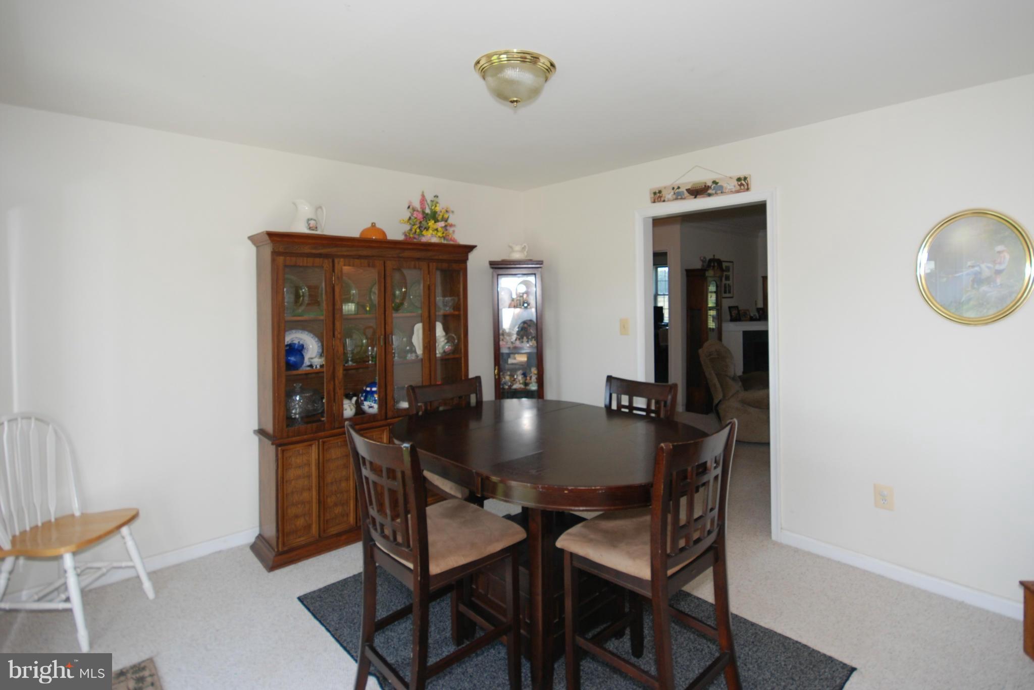 2118 Laurel Grove Road Winchester, VA 22602 - Photo 7 of 29 a view of a dining room with furniture and chandelier