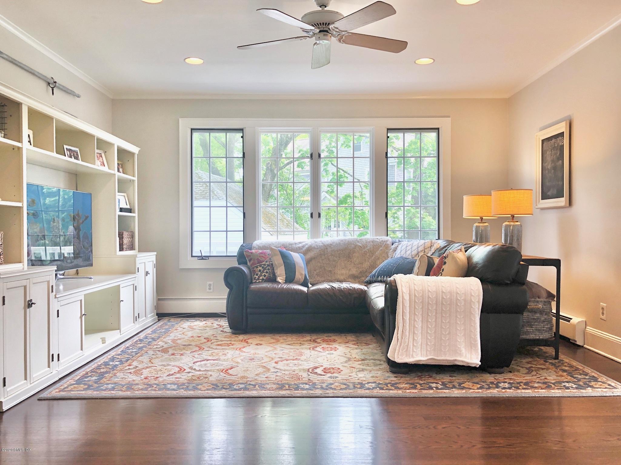 10 Lake Drive South, Unit SOUTH Riverside, CT 06878 - Photo 17 of 45 a living room with furniture and a large window