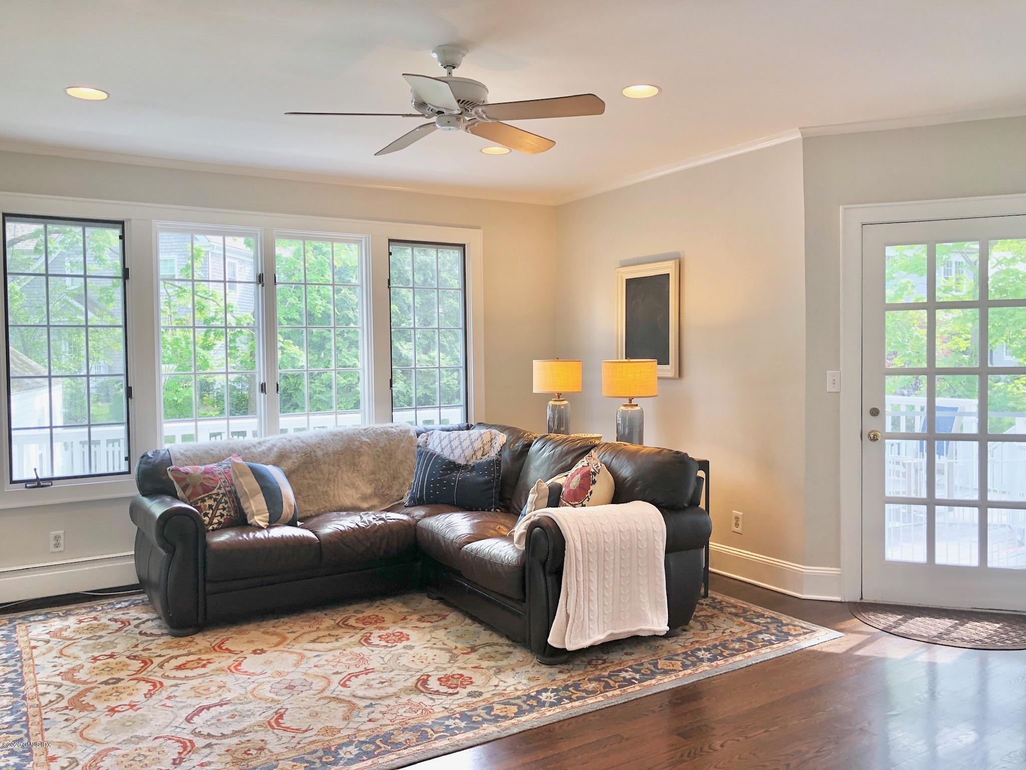 10 Lake Drive South, Unit SOUTH Riverside, CT 06878 - Photo 18 of 45 a living room with furniture and a window