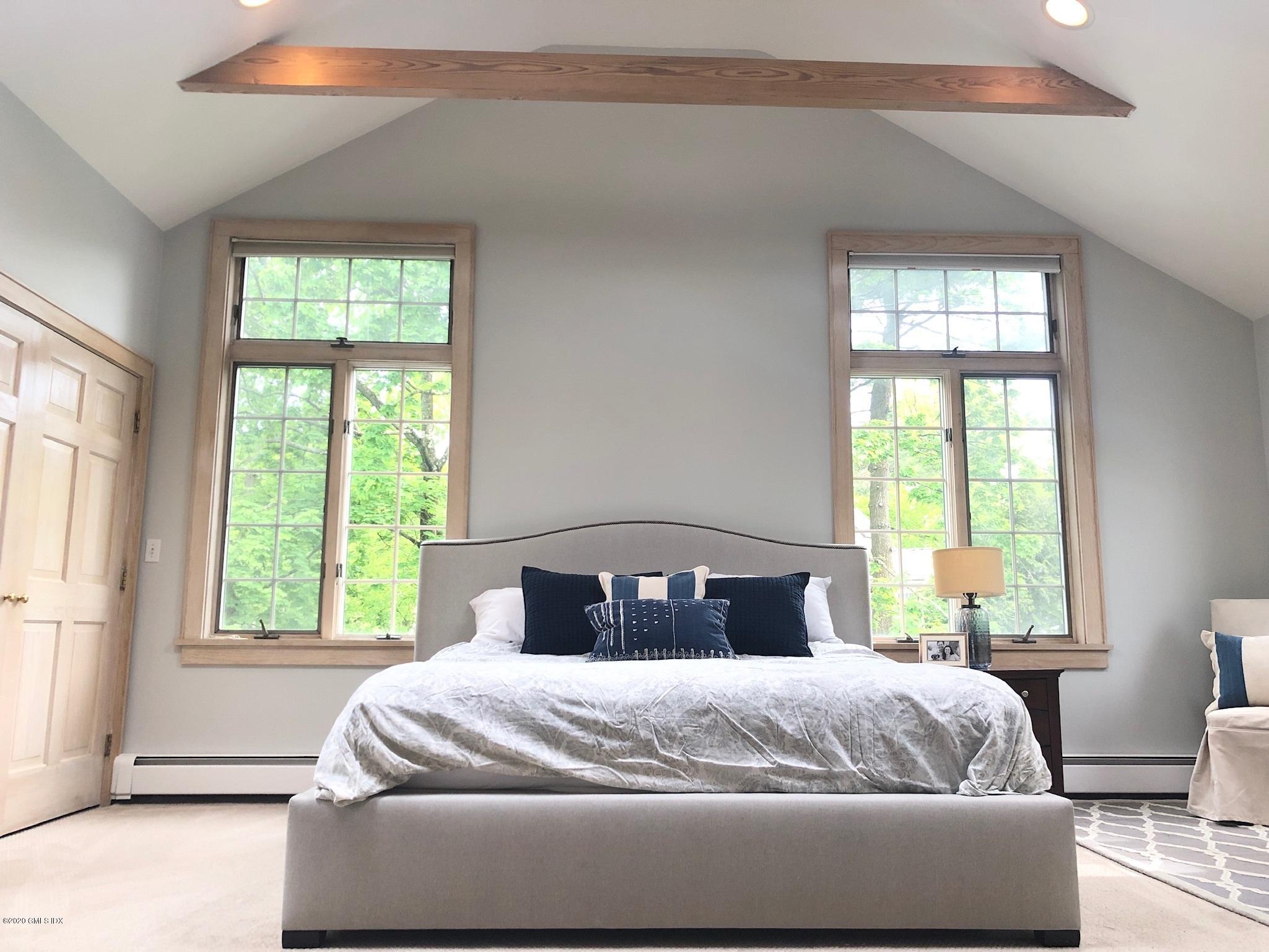 10 Lake Drive South, Unit SOUTH Riverside, CT 06878 - Photo 25 of 45 a bedroom with a large bed and a window