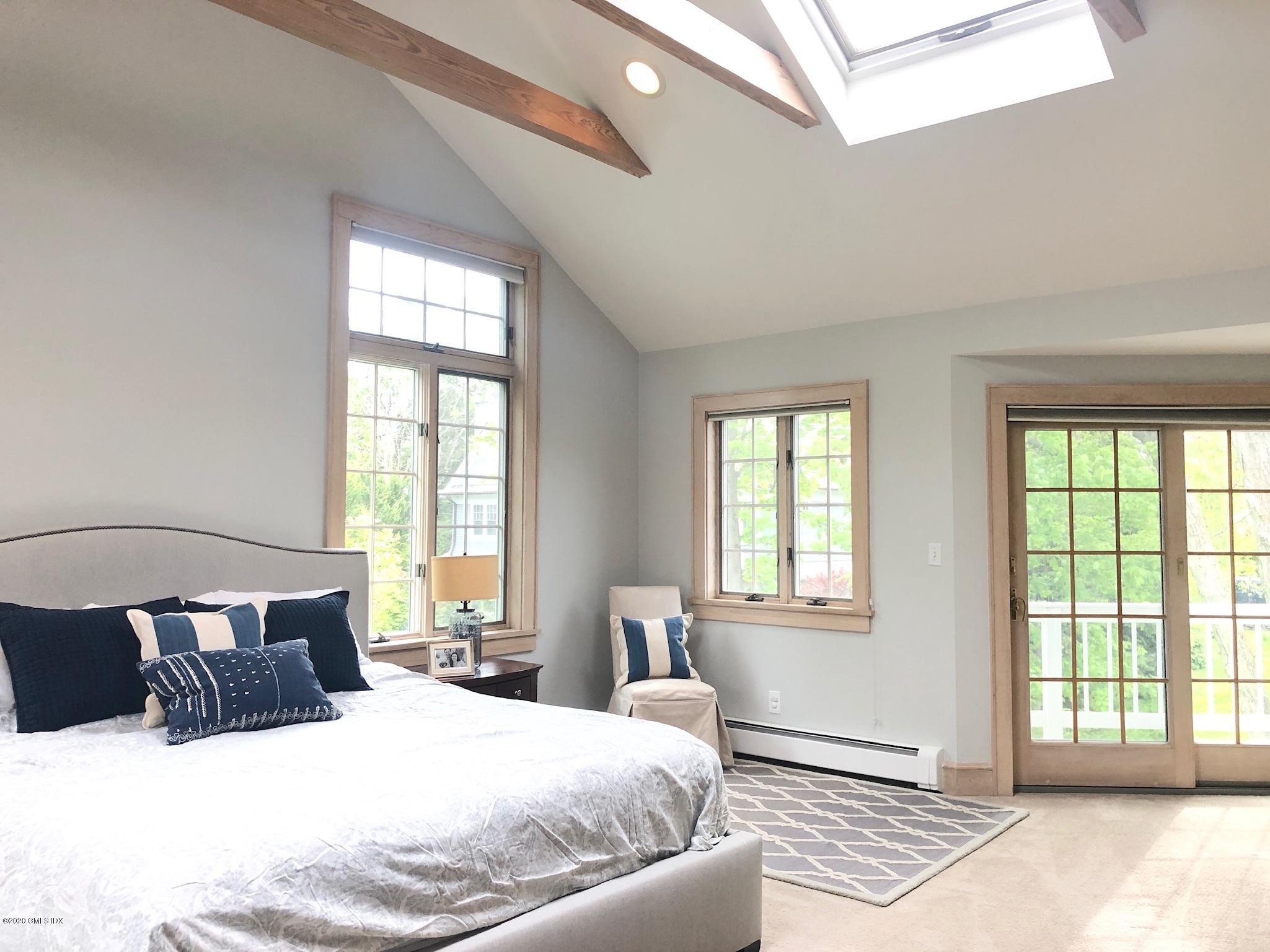 10 Lake Drive South, Unit SOUTH Riverside, CT 06878 - Photo 27 of 45 a bedroom with a large bed and a window