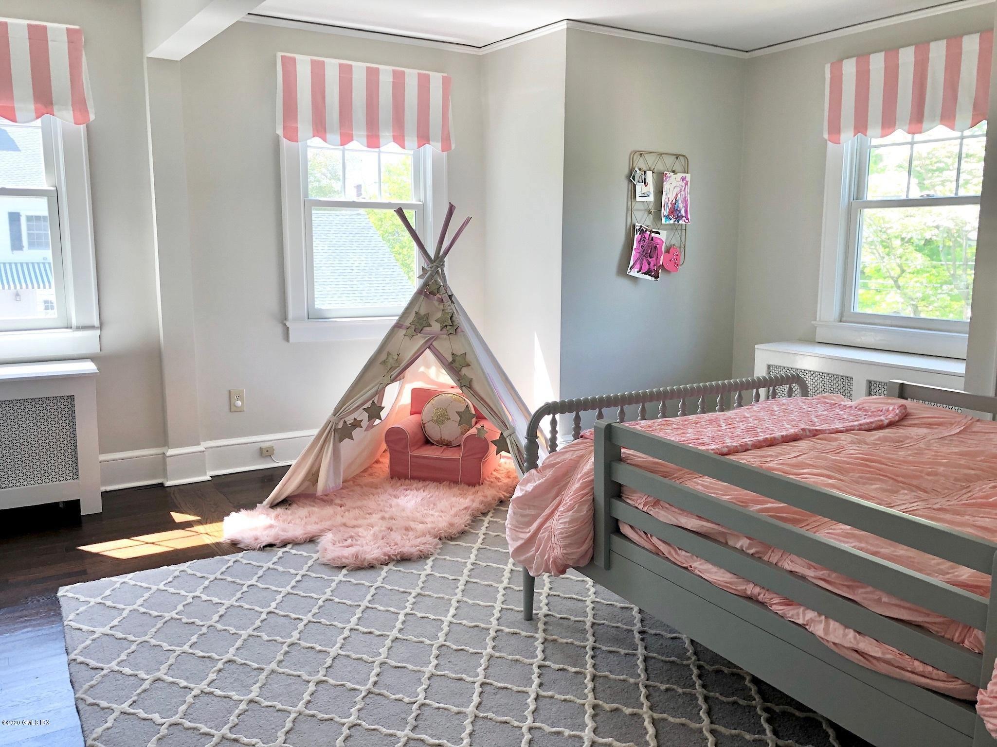 10 Lake Drive South, Unit SOUTH Riverside, CT 06878 - Photo 29 of 45 a bedroom with a bed and a window