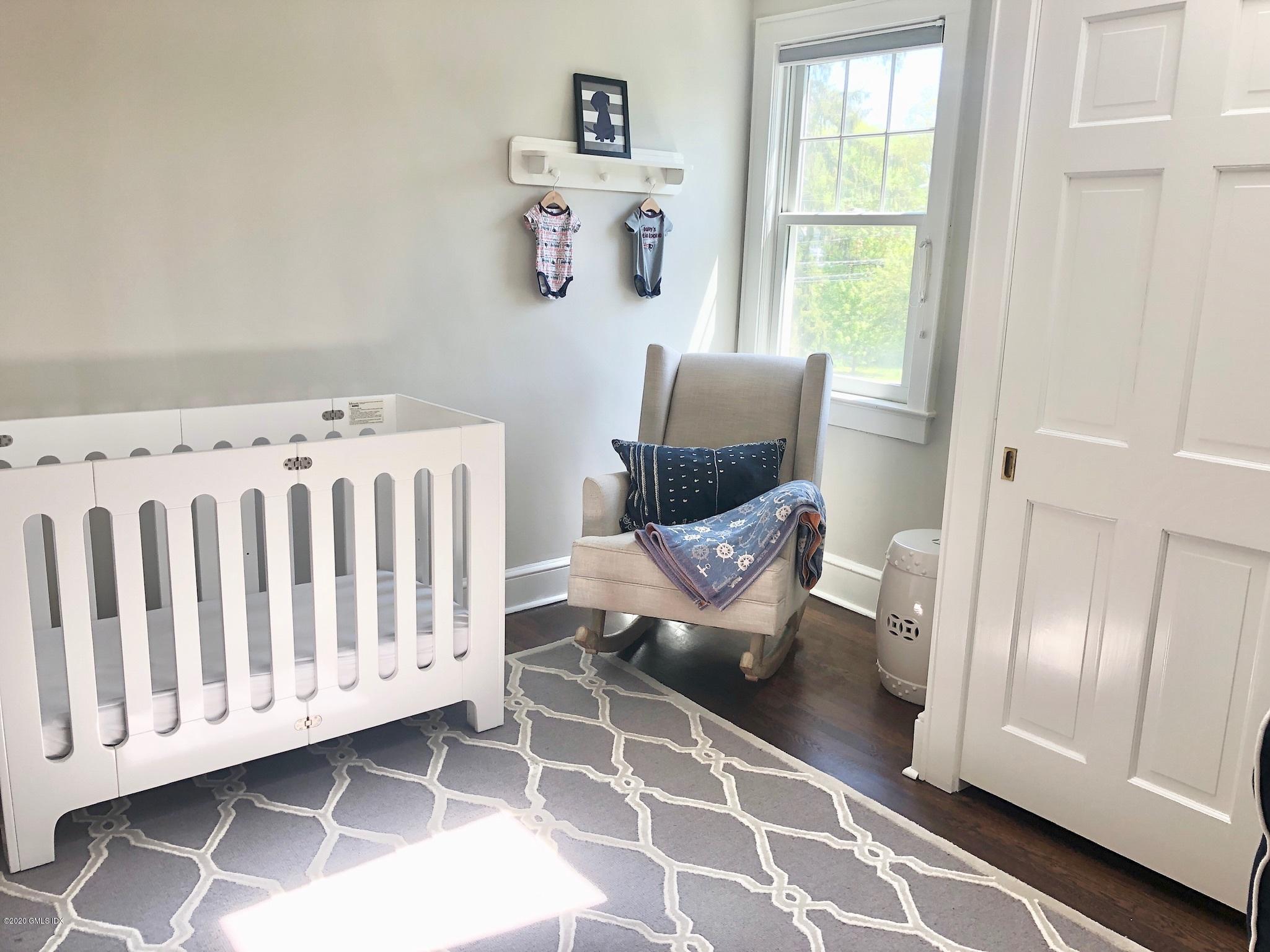 10 Lake Drive South, Unit SOUTH Riverside, CT 06878 - Photo 30 of 45 a living room with furniture and a window