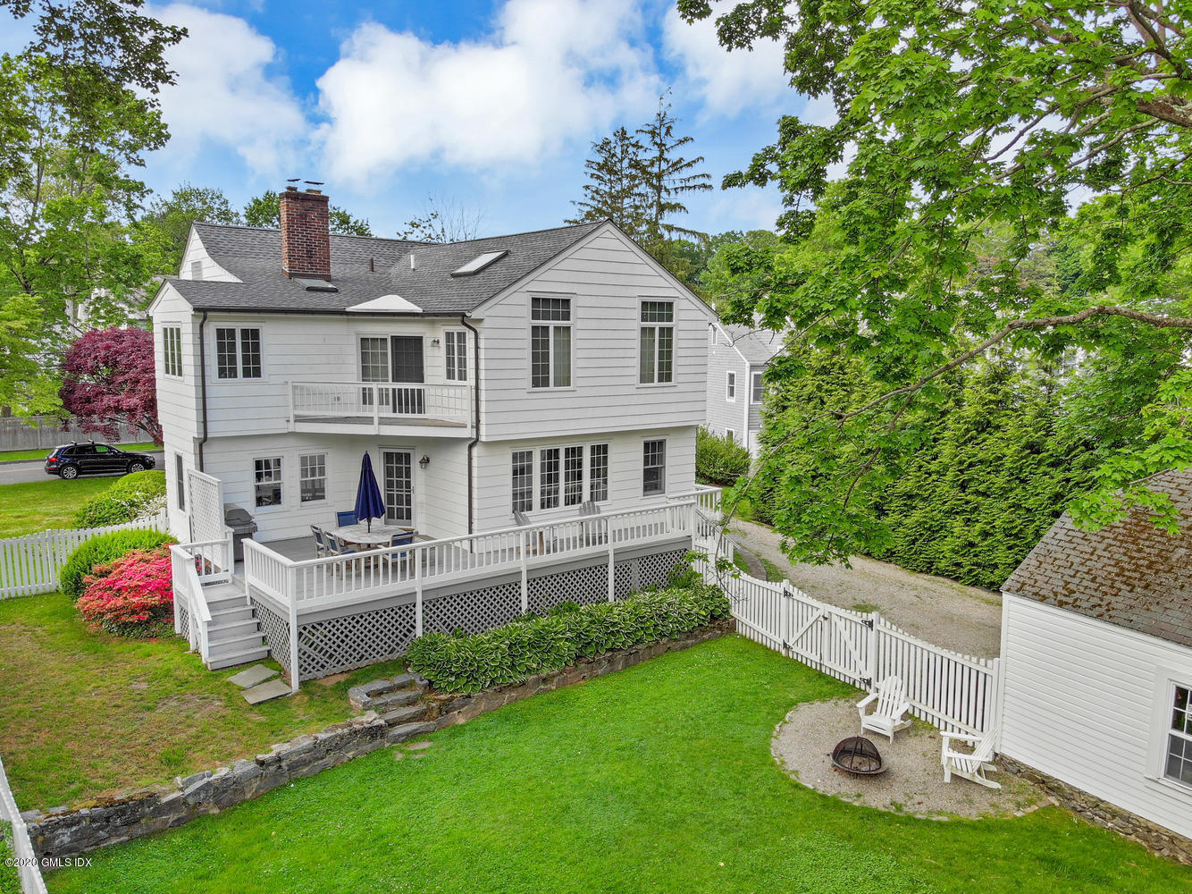 10 Lake Drive South, Unit SOUTH Riverside, CT 06878 - Photo 3 of 45 a view of a house with a yard porch and sitting area