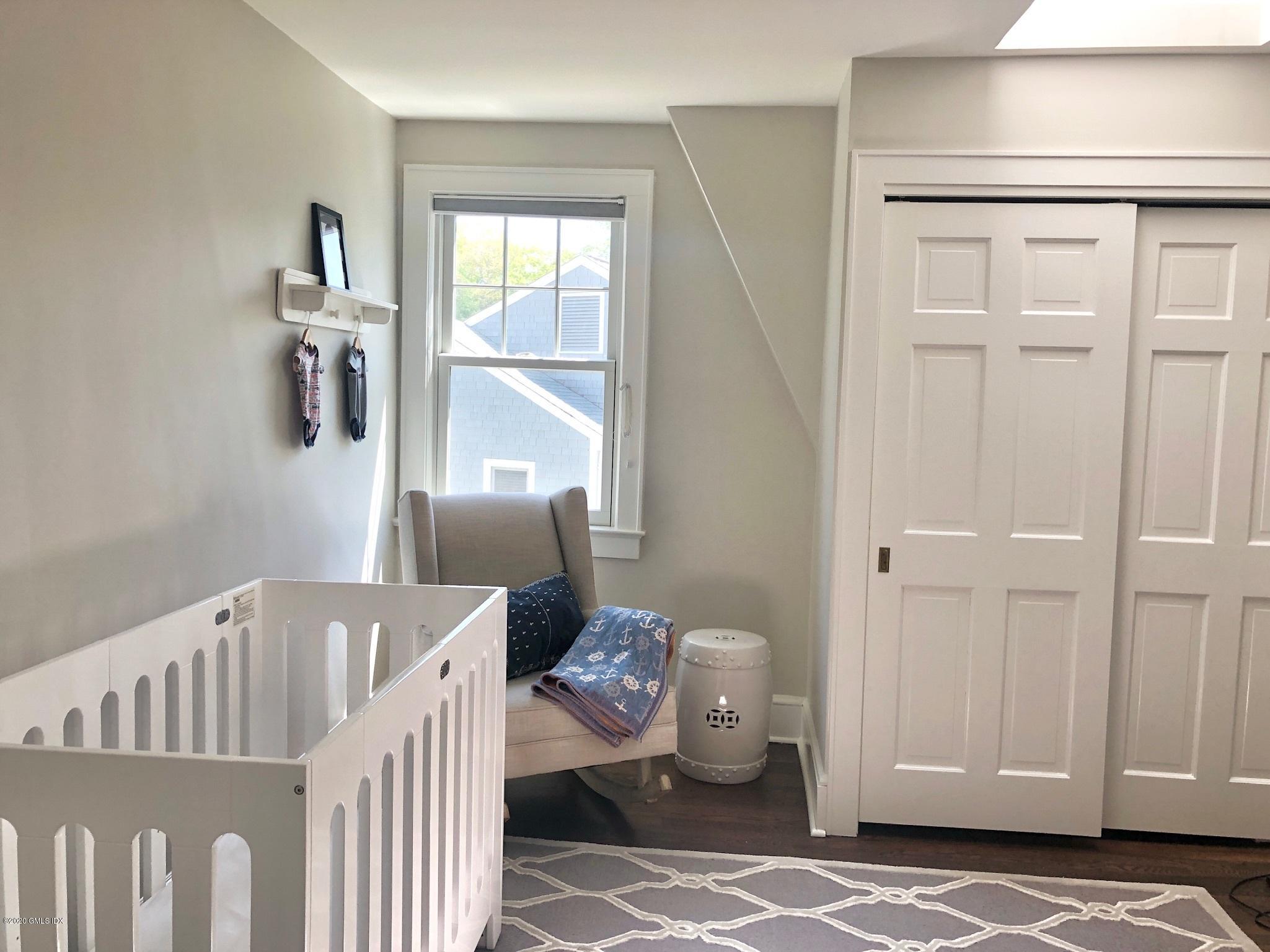 10 Lake Drive South, Unit SOUTH Riverside, CT 06878 - Photo 31 of 45 a living room with furniture and wooden floor