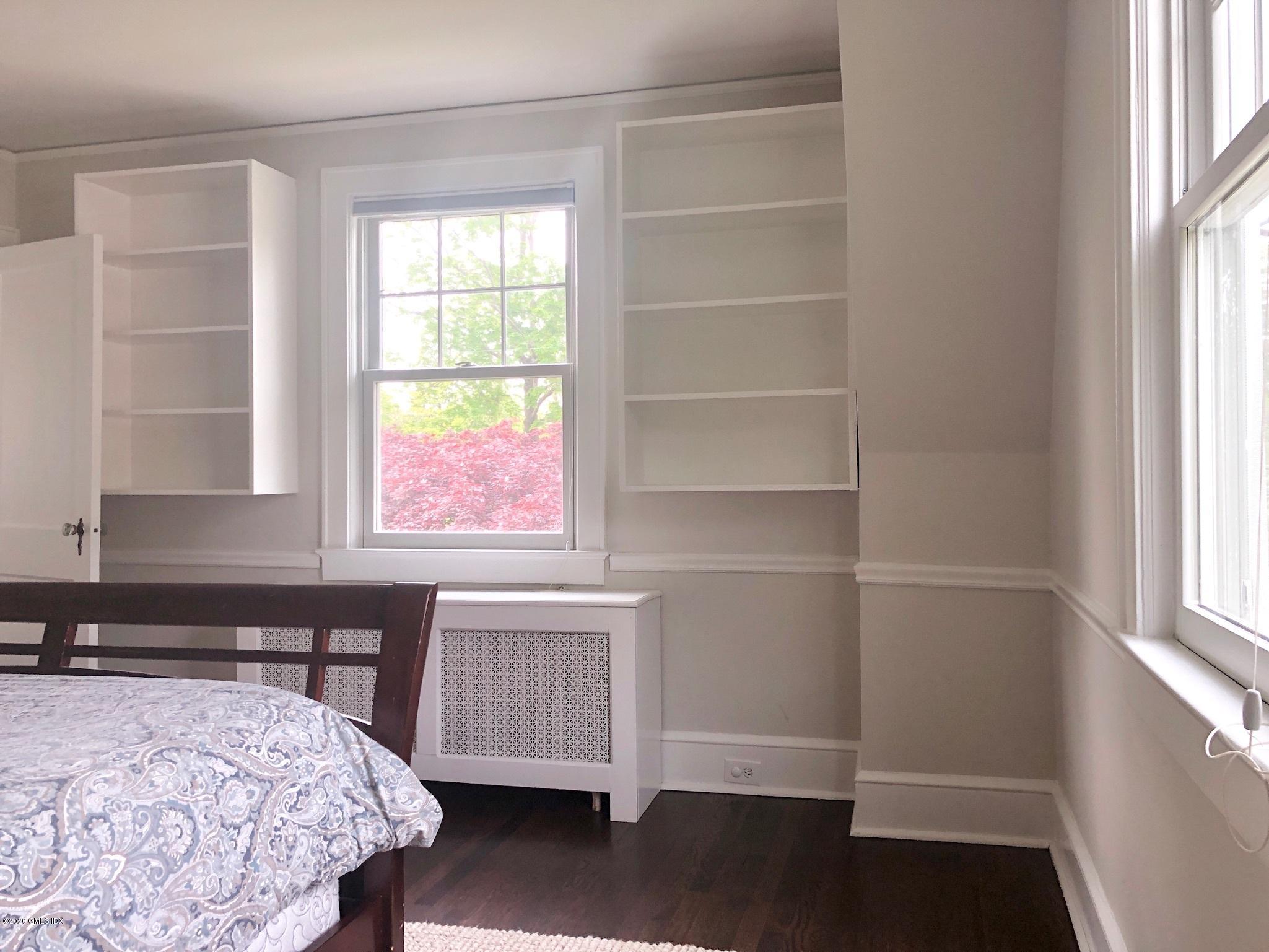 10 Lake Drive South, Unit SOUTH Riverside, CT 06878 - Photo 32 of 45 a bedroom with a bed and a window