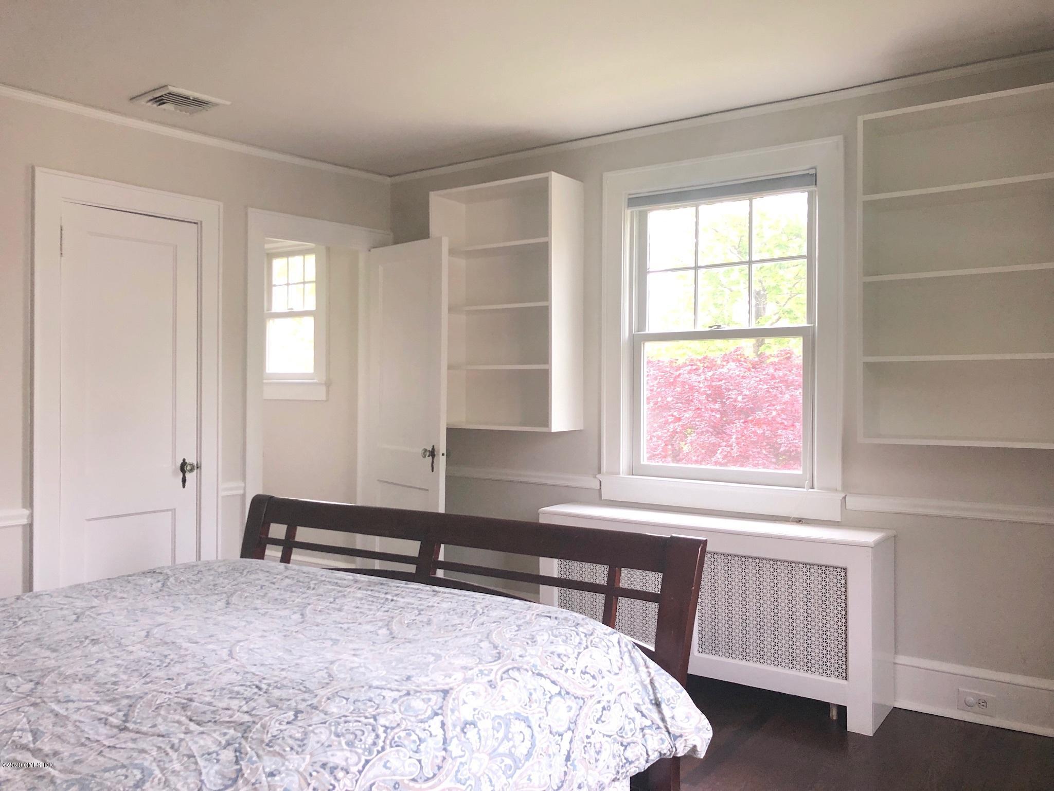 10 Lake Drive South, Unit SOUTH Riverside, CT 06878 - Photo 33 of 45 a bedroom with a bed and a window