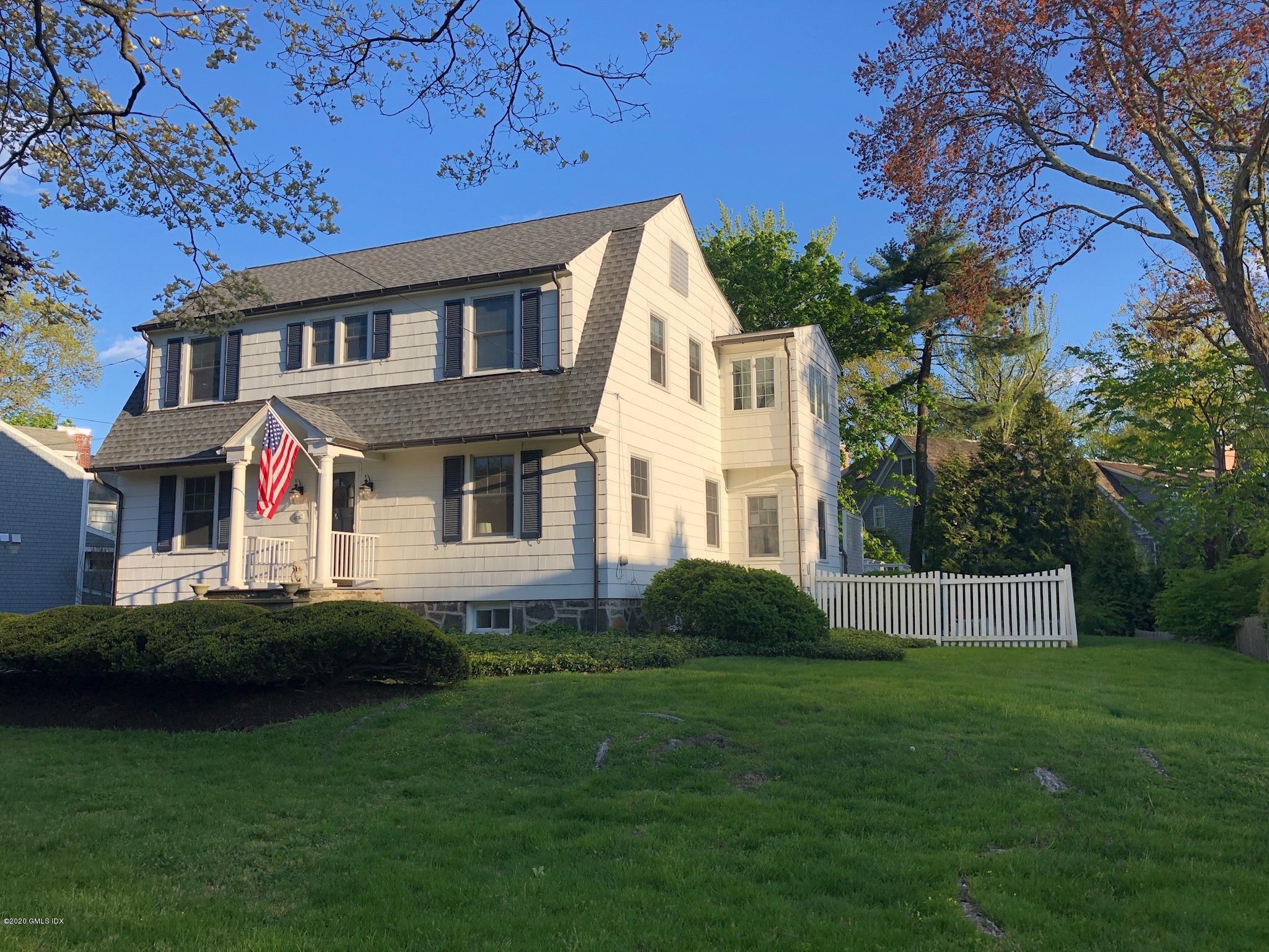 10 Lake Drive South, Unit SOUTH Riverside, CT 06878 - Photo 41 of 45 a front view of a house with a garden