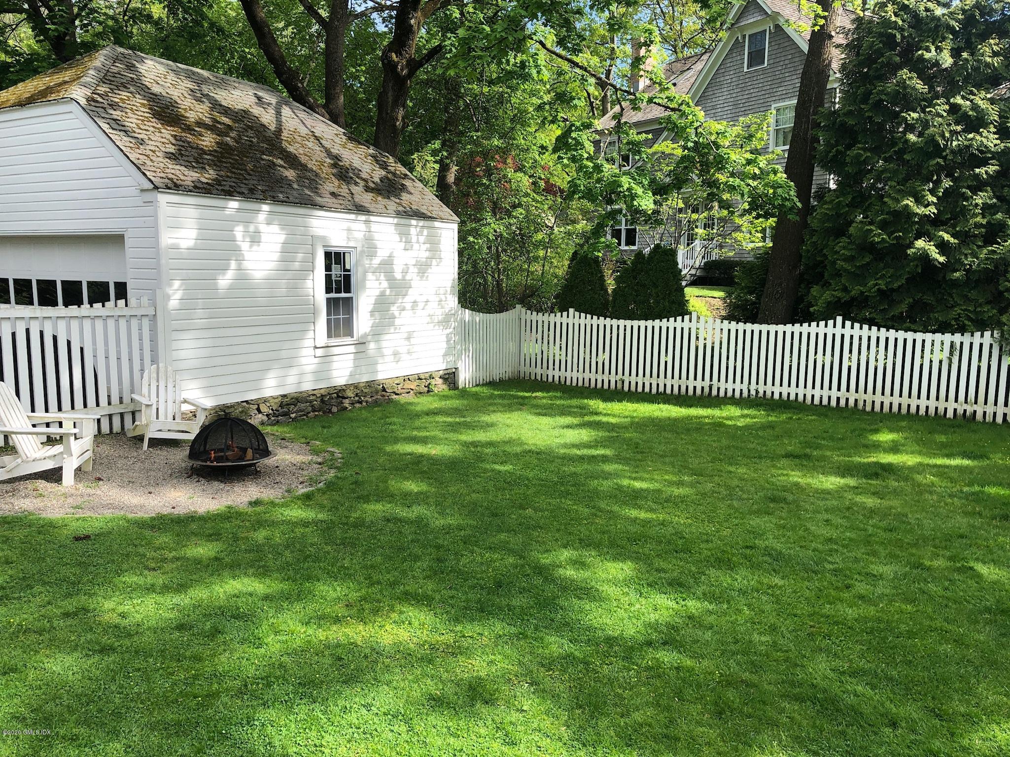 10 Lake Drive South, Unit SOUTH Riverside, CT 06878 - Photo 7 of 45 a view of backyard with a garden and deck