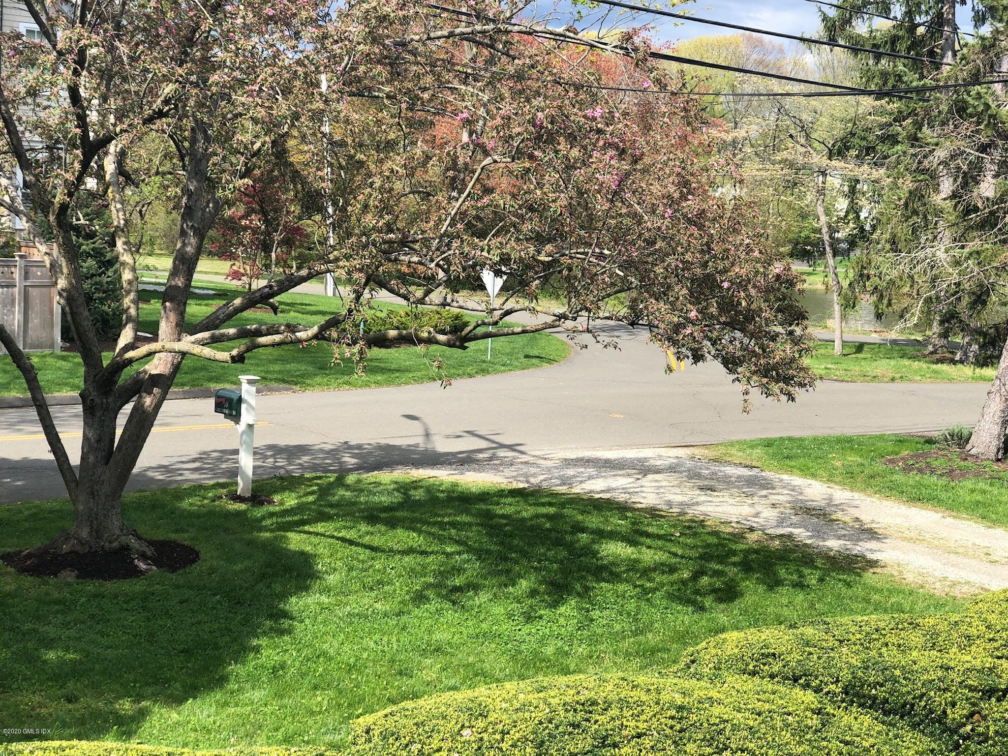 10 Lake Drive South, Unit SOUTH Riverside, CT 06878 - Photo 8 of 45 a view of a yard