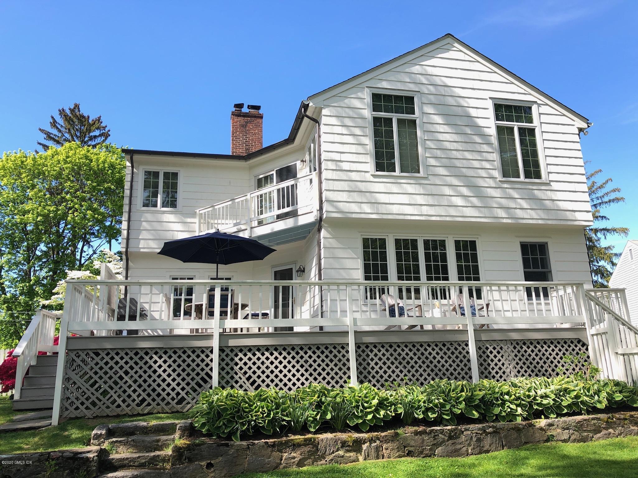 10 Lake Drive South, Unit SOUTH Riverside, CT 06878 - Photo 9 of 45 a front view of a house with a garden
