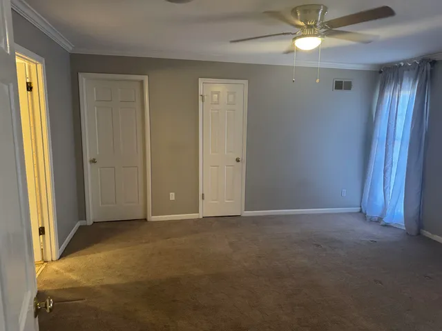 a view of an empty room and window