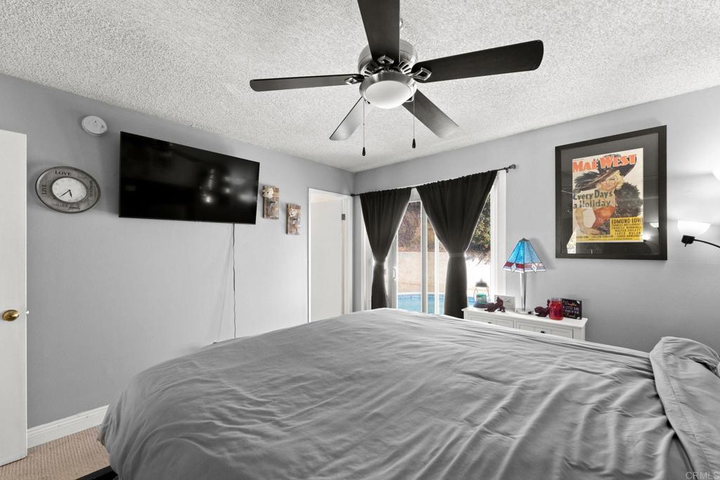 2461 Trace Road Spring Valley, CA 91978 - Photo 12 of 26 a bedroom with a bed and a flat screen tv