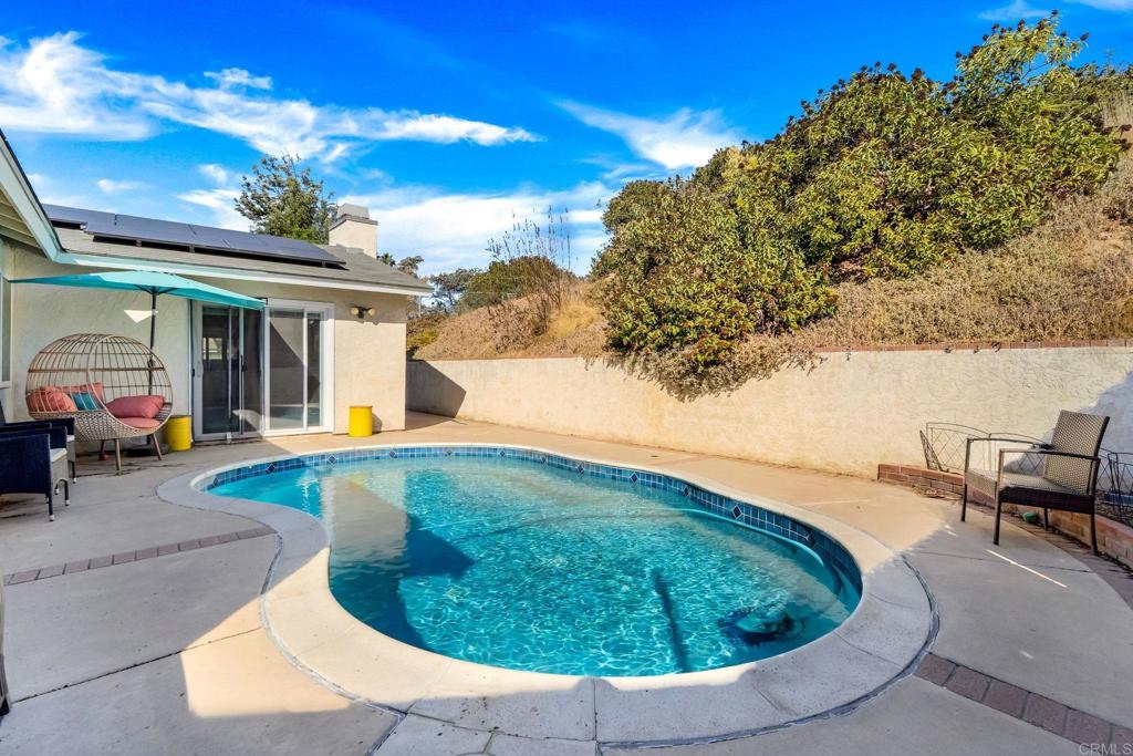 2461 Trace Road Spring Valley, CA 91978 - Photo 20 of 26 a view of a swimming pool with a yard