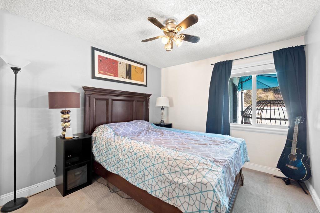 2461 Trace Road Spring Valley, CA 91978 - Photo 9 of 26 a bedroom with a bed and a window