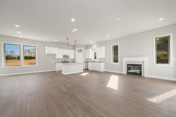 a view of kitchen with furniture and fireplace