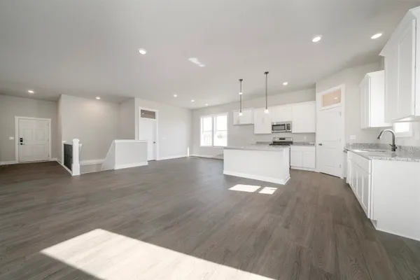 a view of kitchen with wooden floor