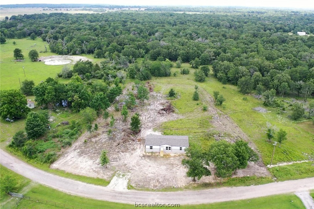 9960 Goose Prairie Road Midway, TX 75852 - Photo 7 of 36 a view of a lake with large trees