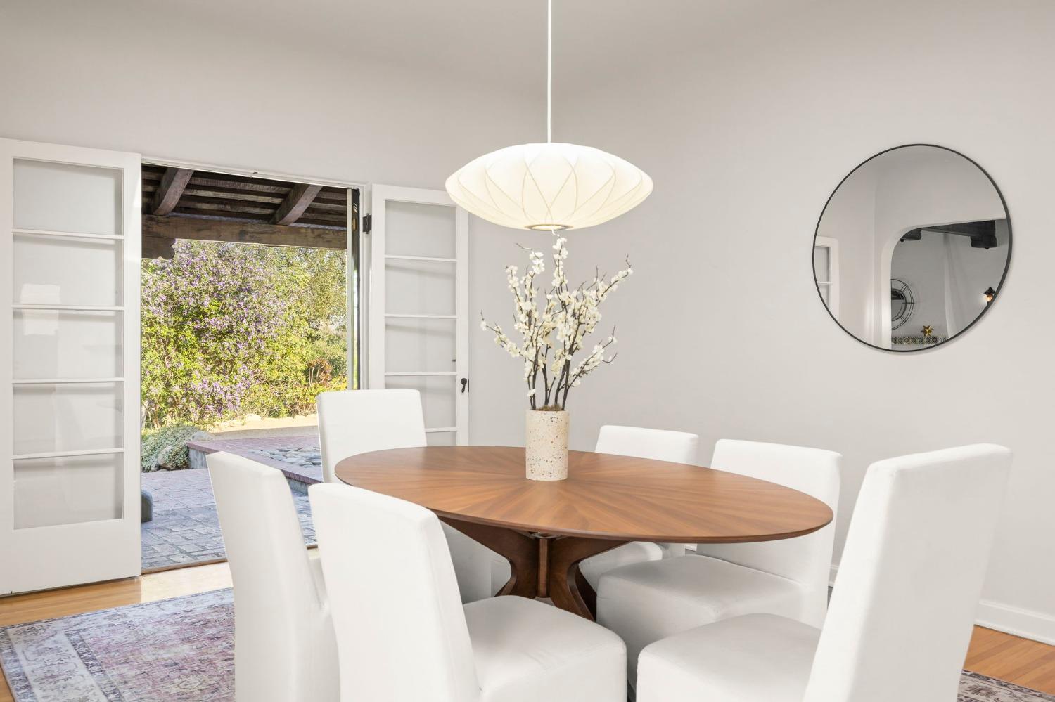 105 Foothill Road Ojai, CA 93023 - Photo 16 of 38 a view of a dining room with furniture and wooden floor
