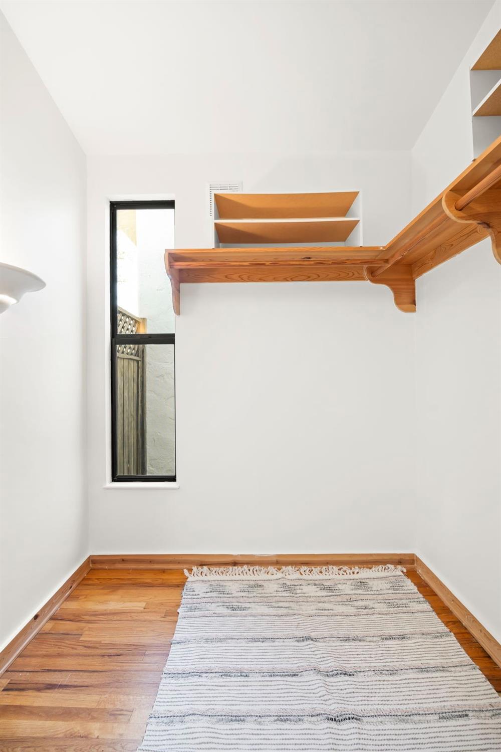 105 Foothill Road Ojai, CA 93023 - Photo 31 of 38 a view of a room with wooden floor and cabinet