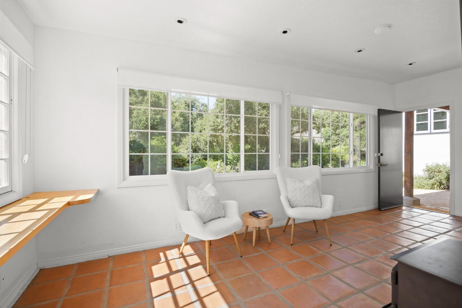 105 Foothill Road Ojai, CA 93023 - Photo 35 of 38 a living room with furniture and a large window