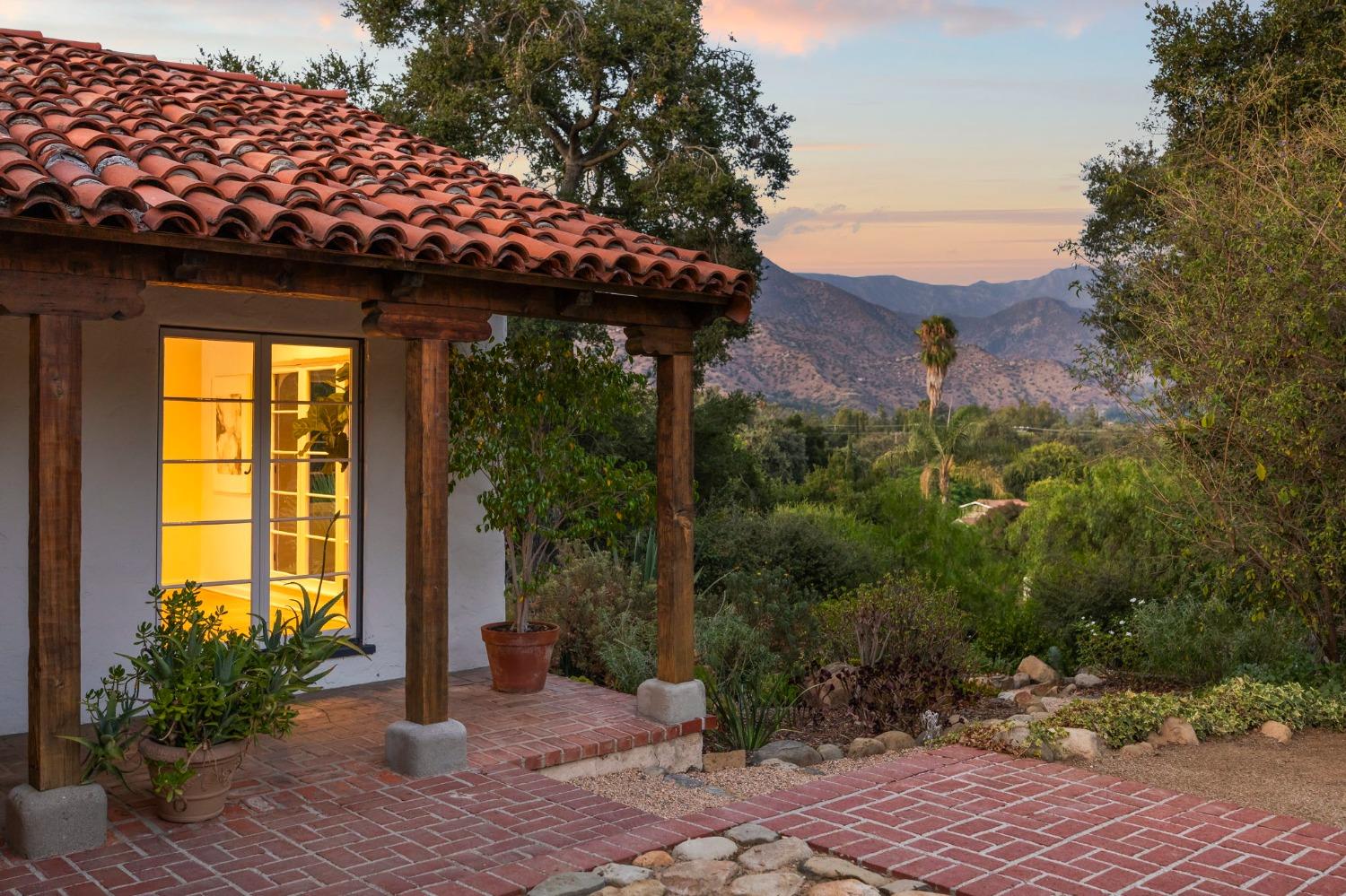 105 Foothill Road Ojai, CA 93023 - Photo 7 of 38 a view of a patio with plants and a table and chairs