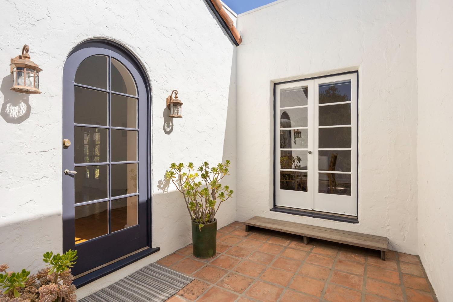 105 Foothill Road Ojai, CA 93023 - Photo 10 of 38 a view of front door with potted plants
