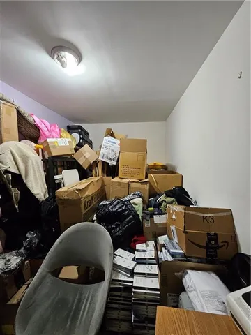 a living room with lots of furniture and clothes