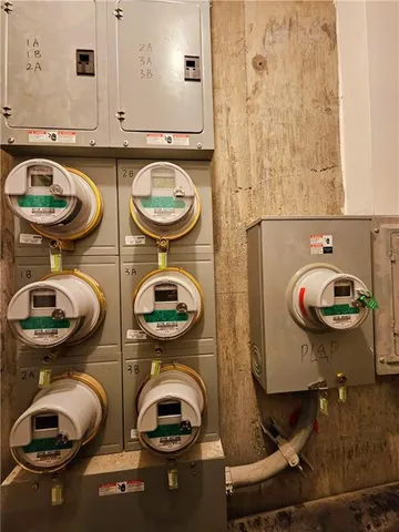 a bathroom with a toilet a sink and a mirror